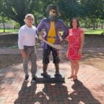Image of Dr. David Smith (left) and Dr. Katherine Ford (right) posed with ECU Pirate statue Sir Vire (middle).