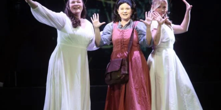 Casey Wild as Joan of Arc, center, is guided by St. Catherine, played by Brielle Herlein, left, and St. Margaret, played by Reagan Cochrane, in the ECU/Loessin Playhouse staging of 