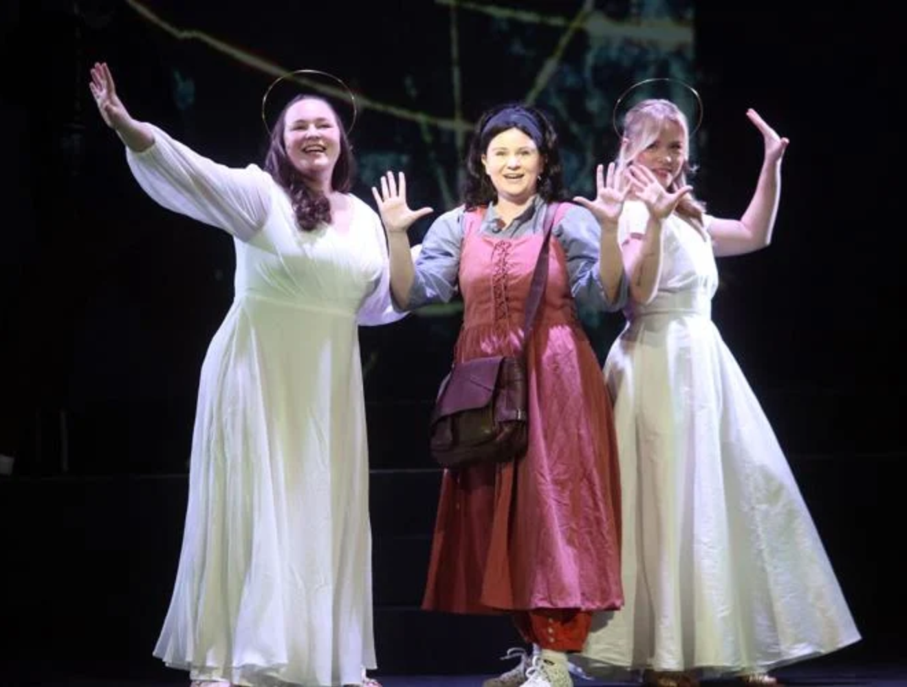 Casey Wild as Joan of Arc, center, is guided by St. Catherine, played by Brielle Herlein, left, and St. Margaret, played by Reagan Cochrane, in the ECU/Loessin Playhouse staging of "Wild Heart." Photo from Scott Davis for the Daily Reflector